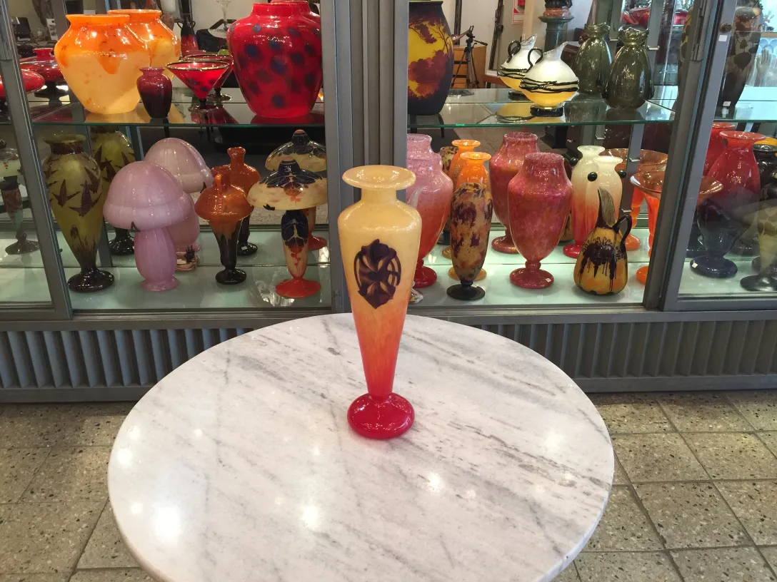 antique signed glass by Schneider, artistically decorated, in an antique setting