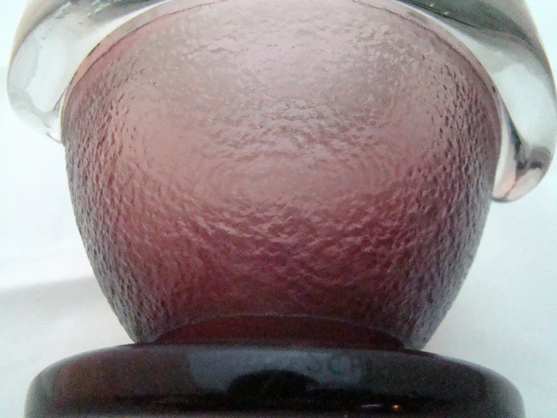 Antique signed glass by Schneider with colorful design.