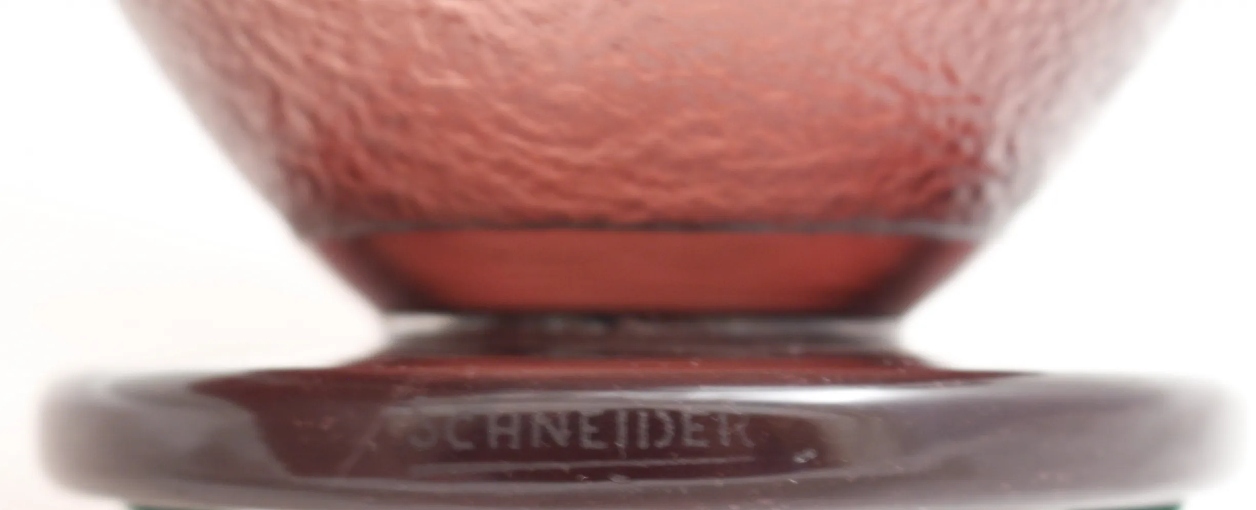 signed glass by schneider, antique style, reddish color