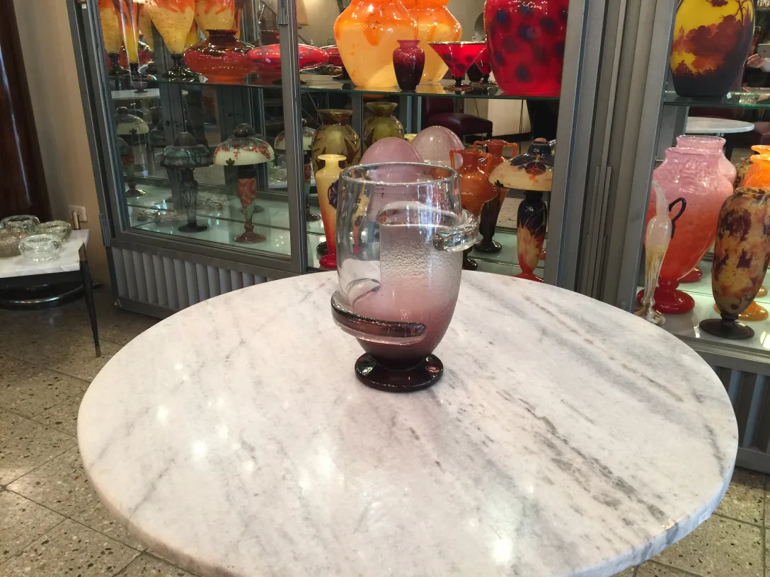 rounded signed glass in an antique setting