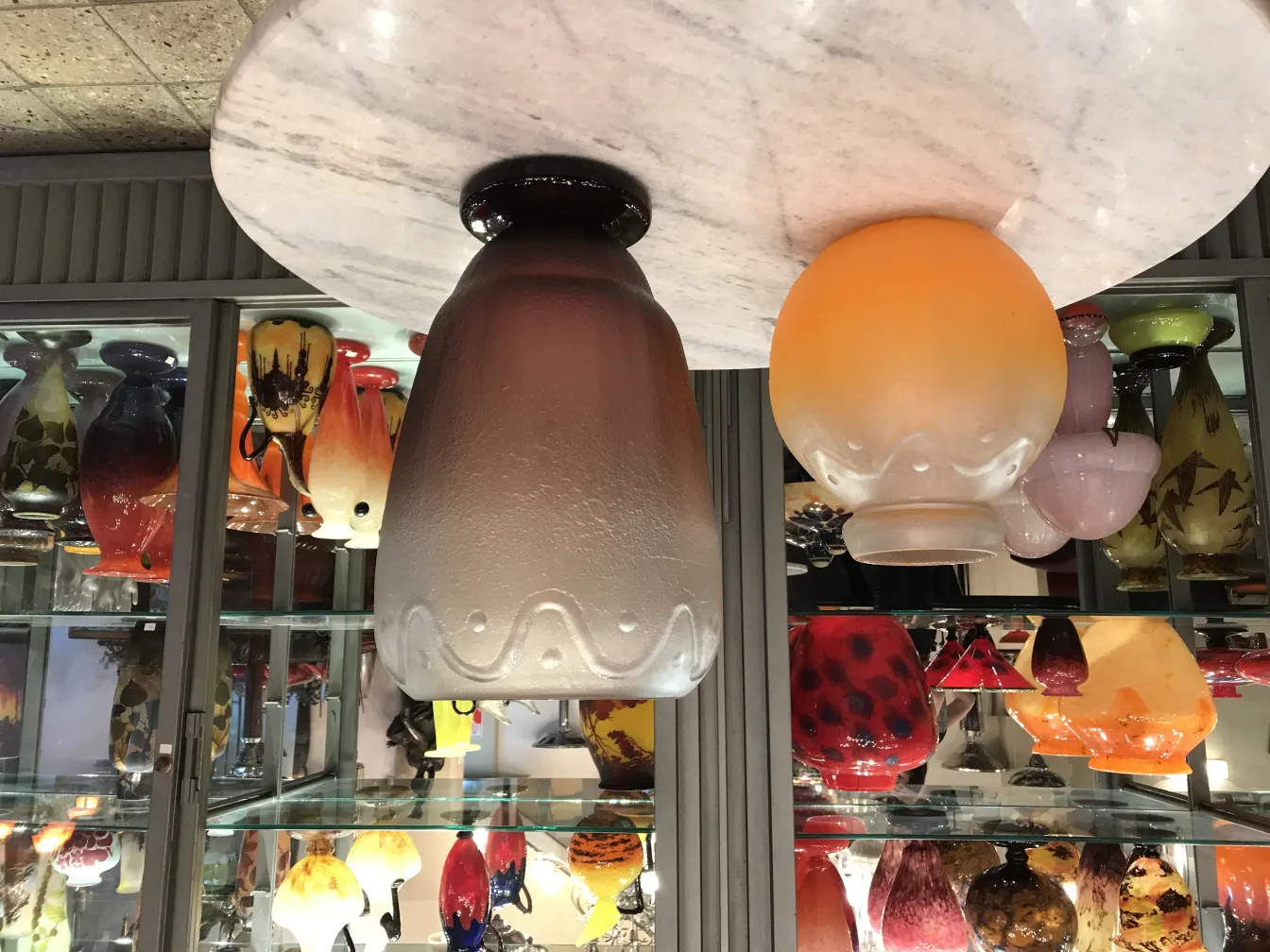 signed glass by Schneider, surrounded by antique pieces