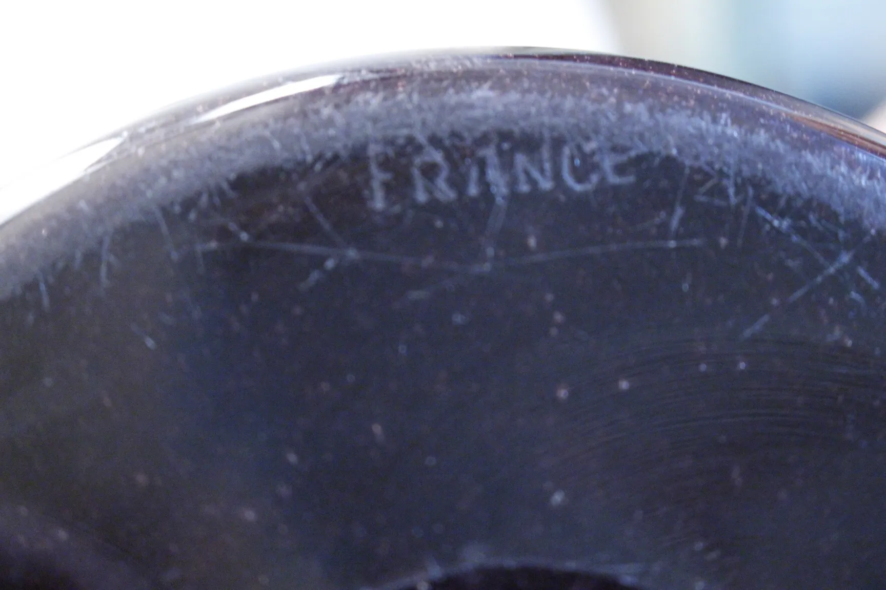 signed glass by Schneider showing clear details, antique setting