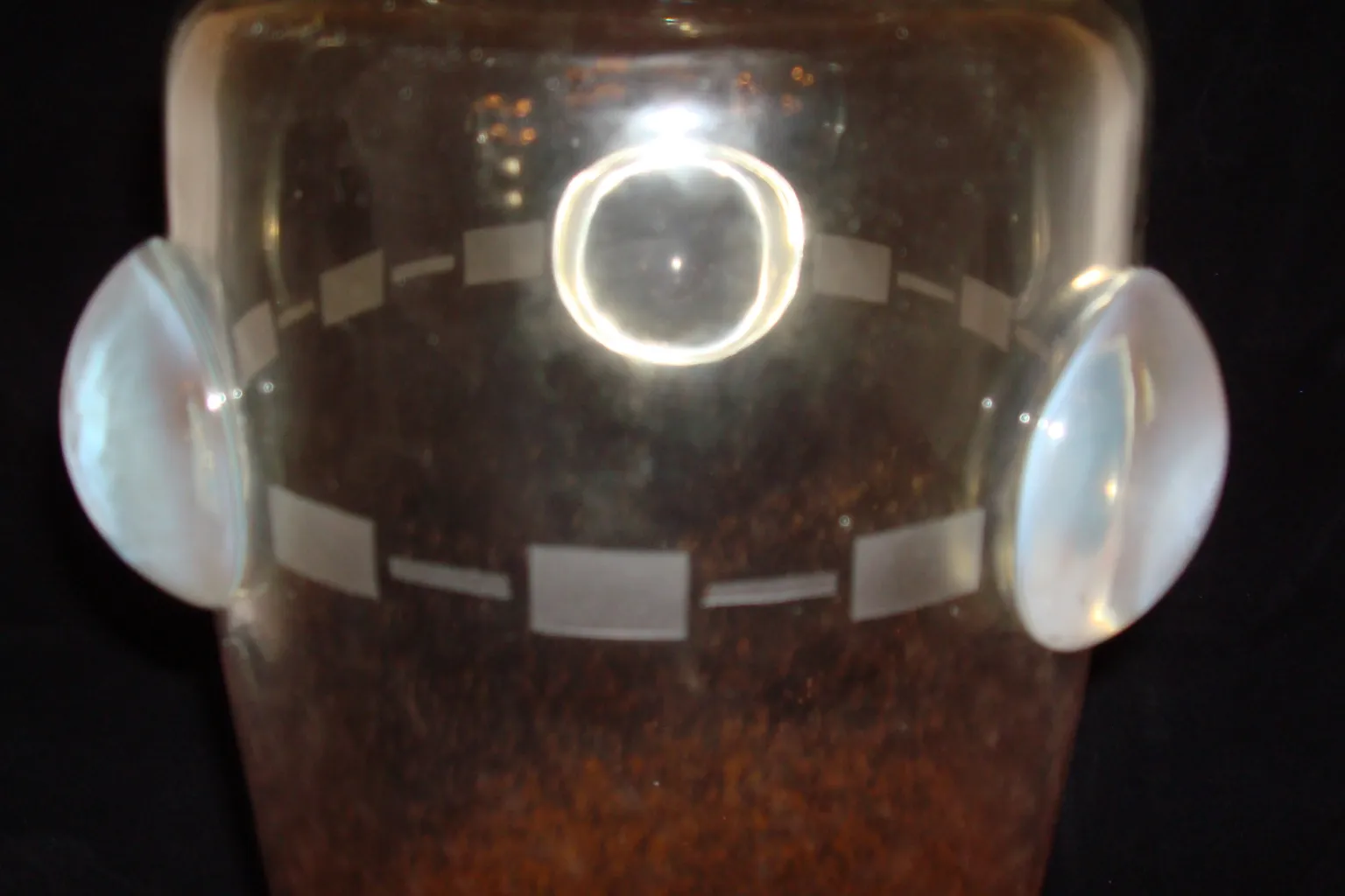 glass signed with decorative details and elegant shape