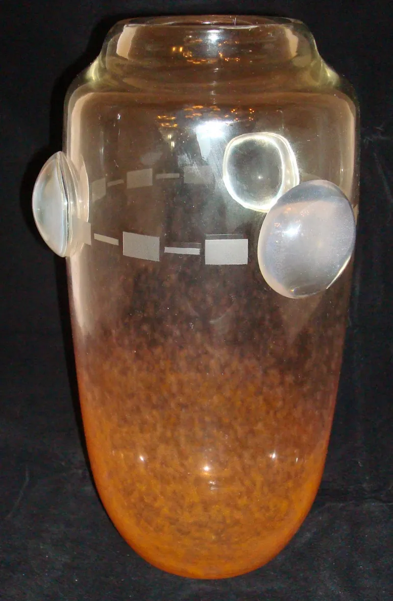 antique signed glass by Schneider, amber color with decorative shapes