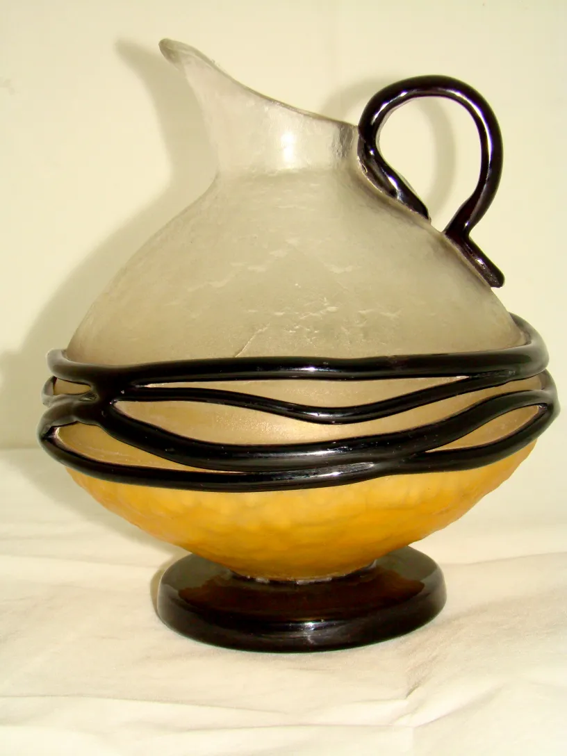 Glass signed by Schneider with a colorful base, antique style.