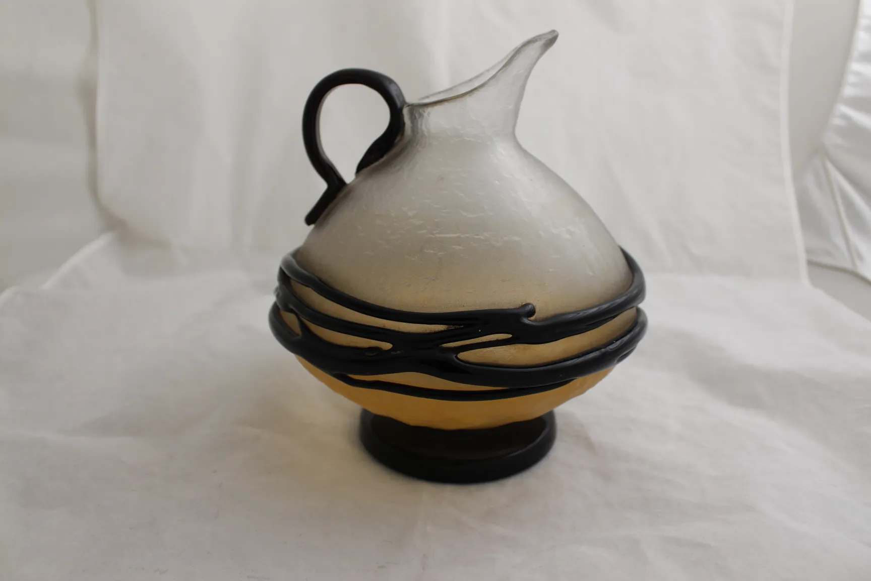 antique pitcher of signed glass by Schneider in yellow and black tones