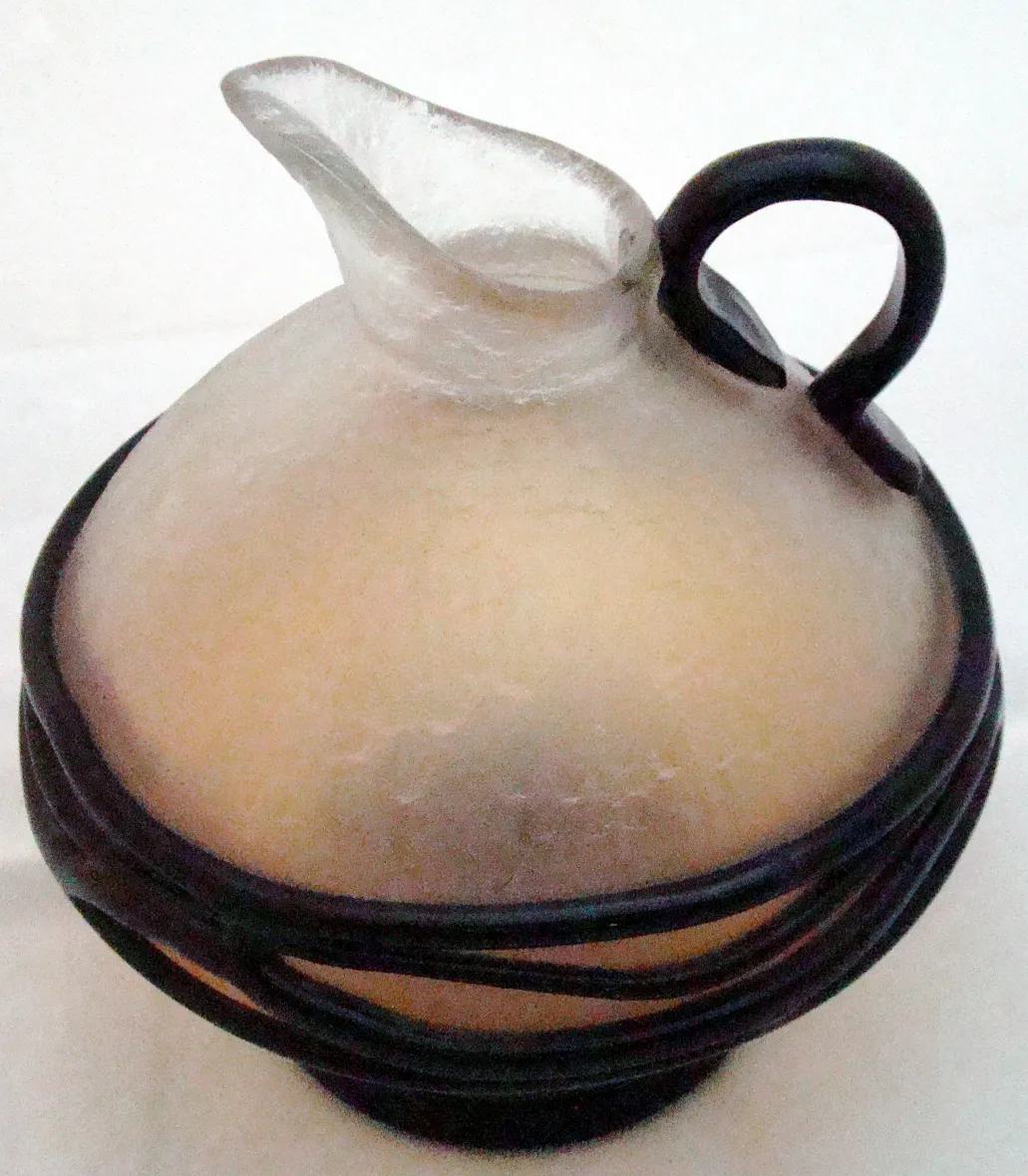 antique glass with round shape and unique design, signed