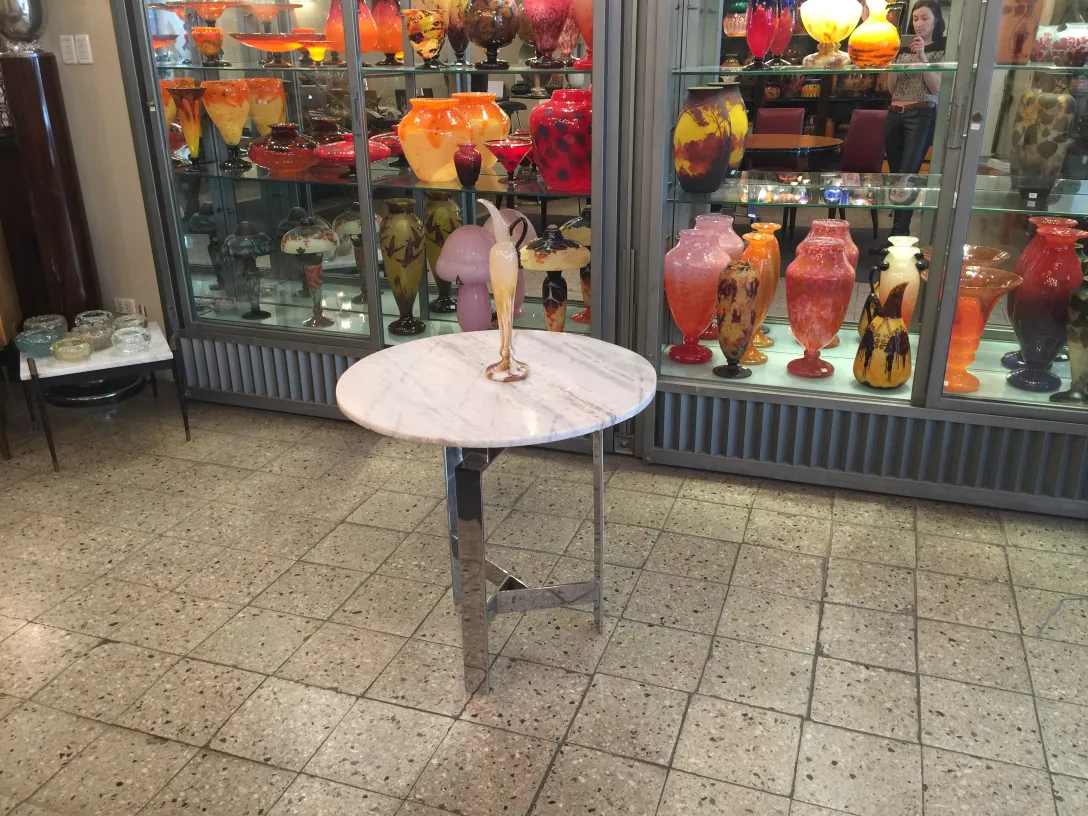 Signed glass by Schneider, antique decorative piece displayed among colorful glass objects.