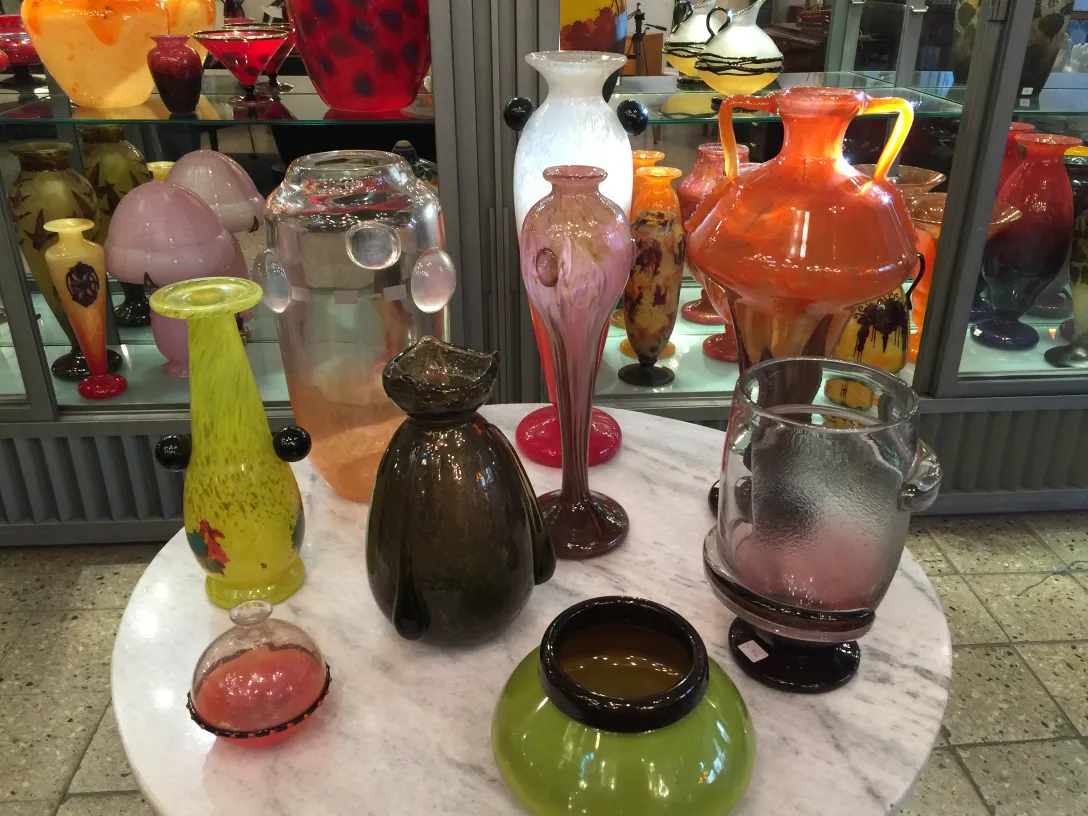 Beautiful signed glass Schneider in a varied antique display.