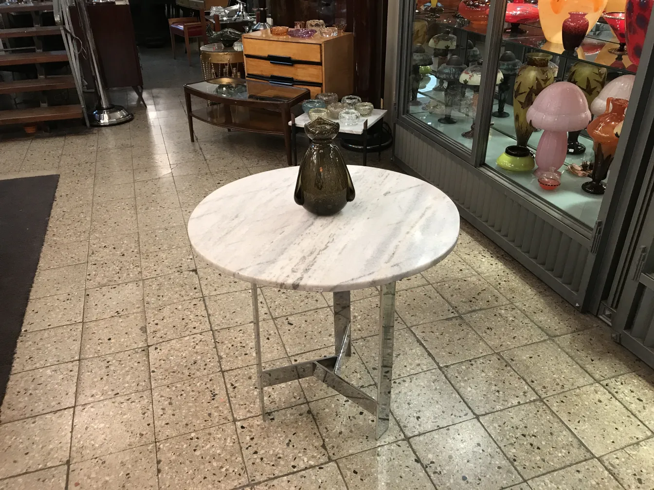 signed schneider glass on antique table with decor