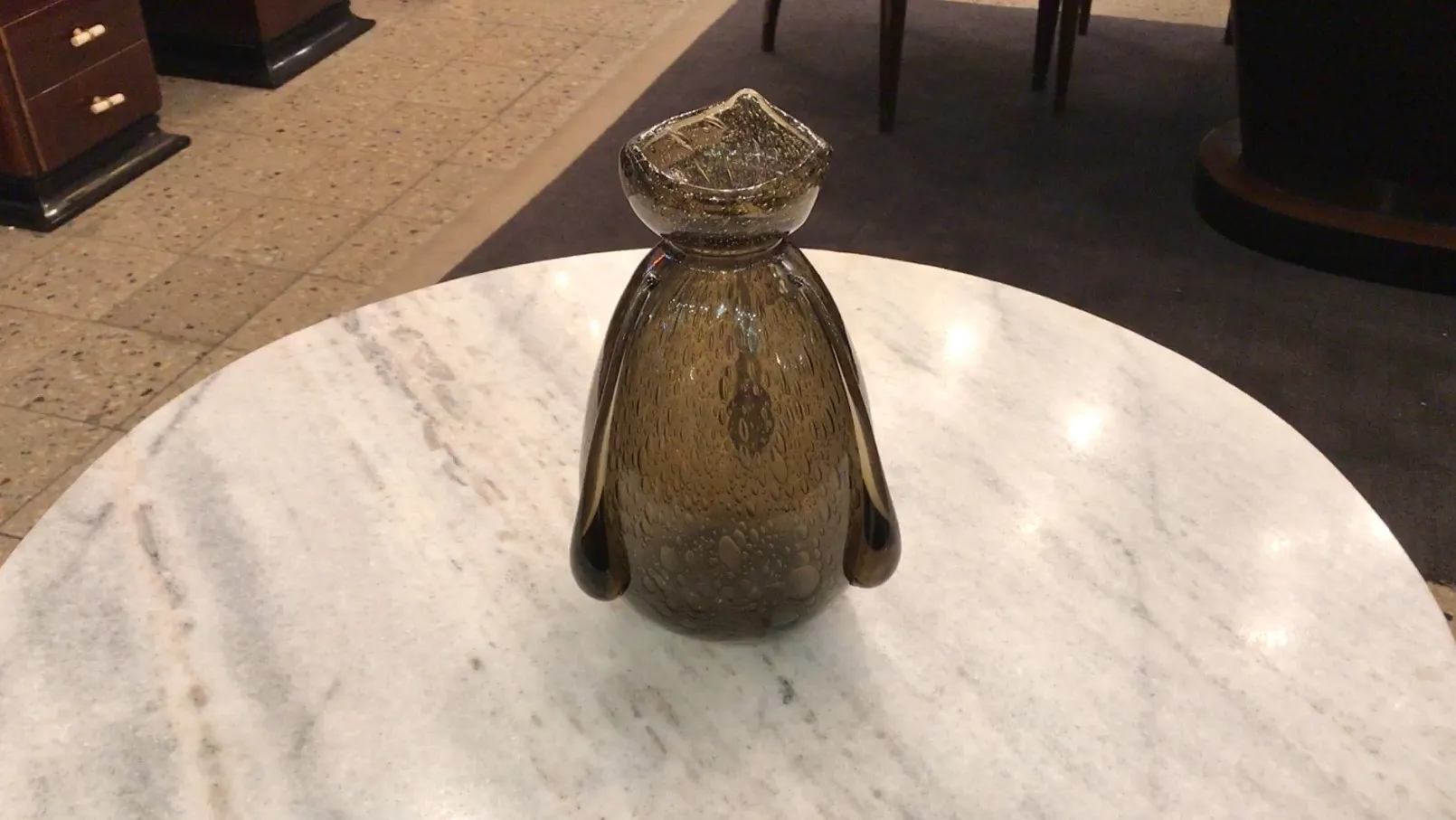 antique signed glass with bubbles, on display