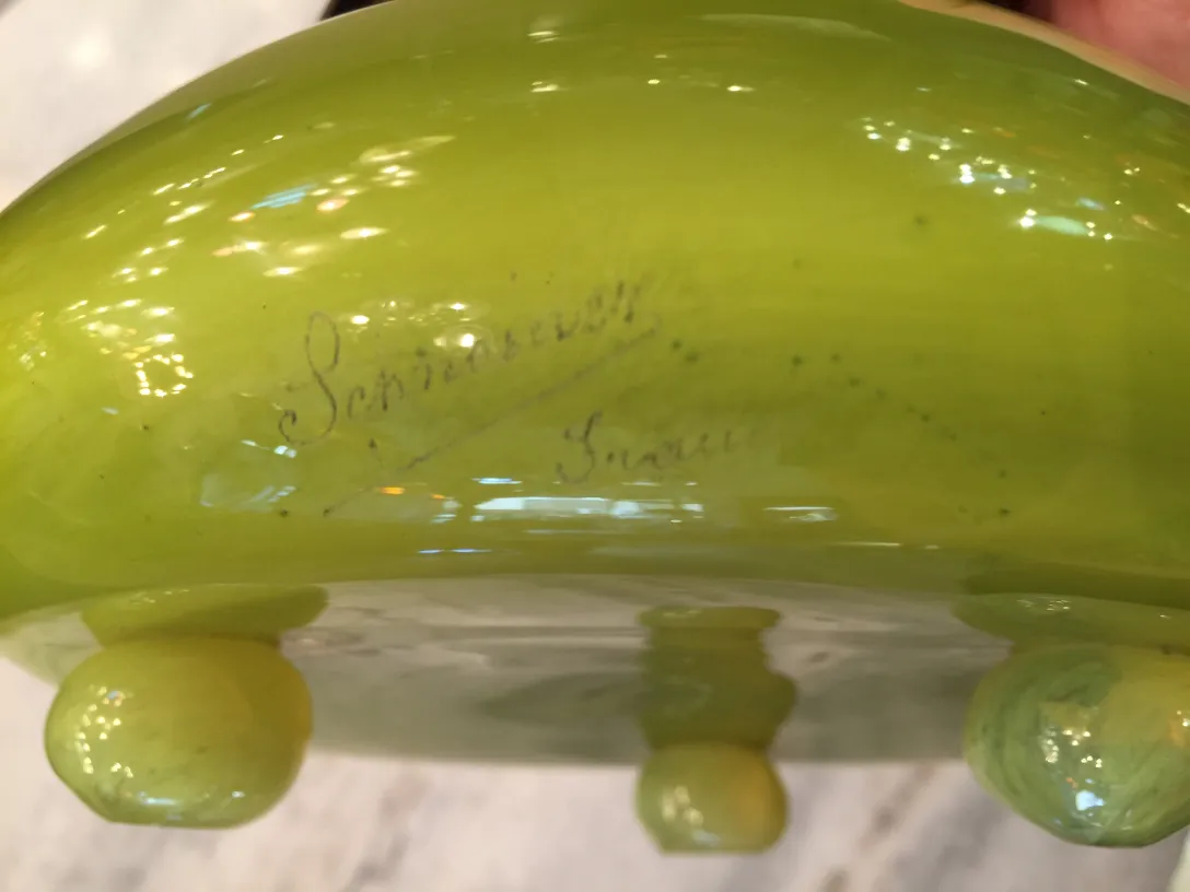 Antique signed glass by Schneider, bright green color with smooth details.