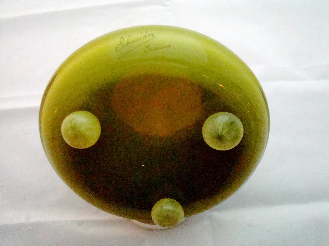 signed glass with green details and oval shape