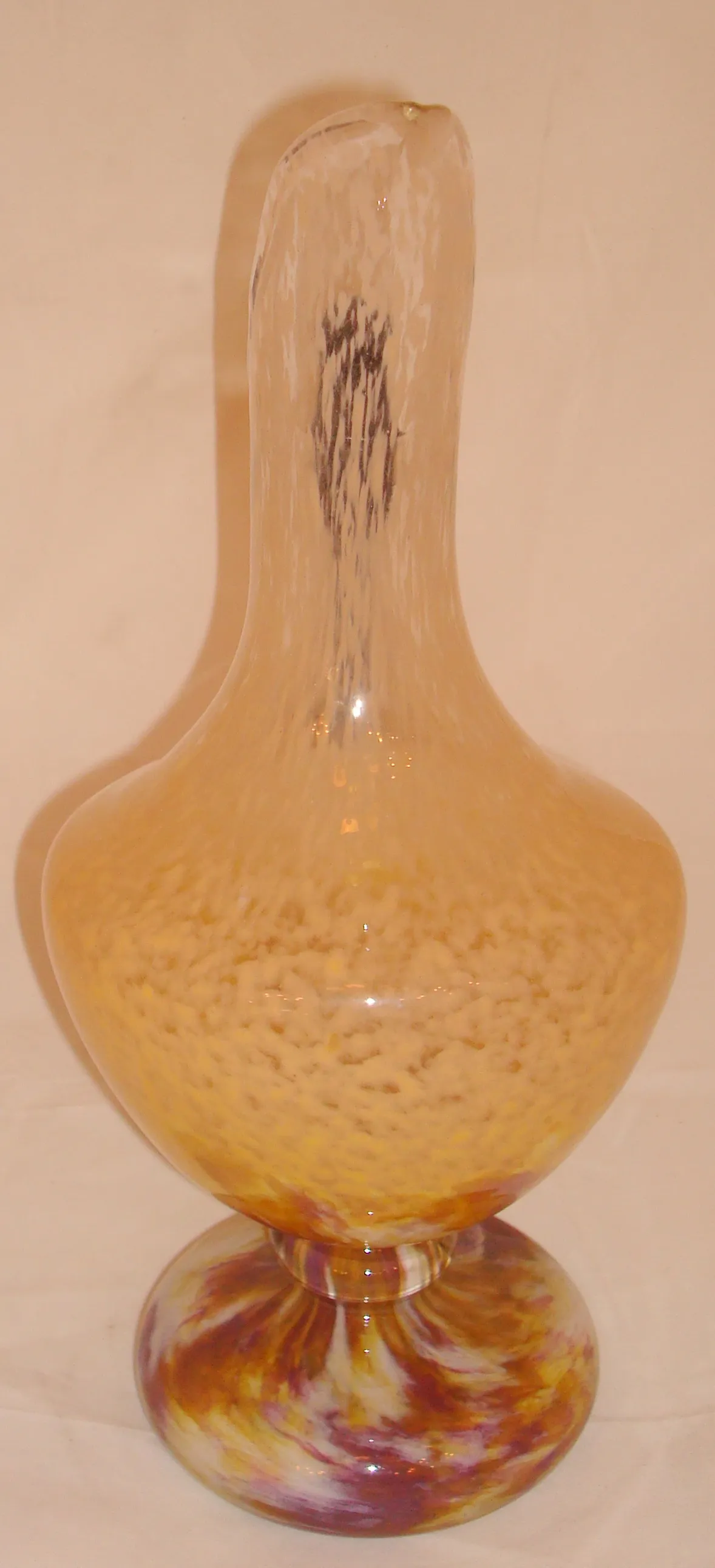 Signed glass by Schneider with decorative design in color