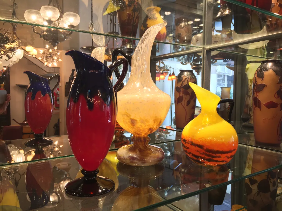 colorful glass vases with elegant shapes in a display case
