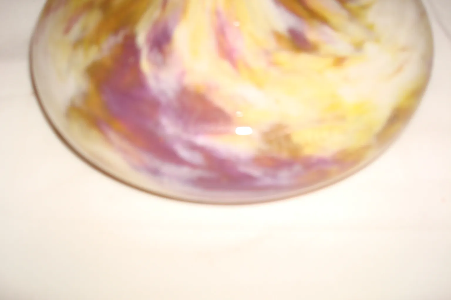 Antique signed glass by Schneider, featuring purple and yellow hues.