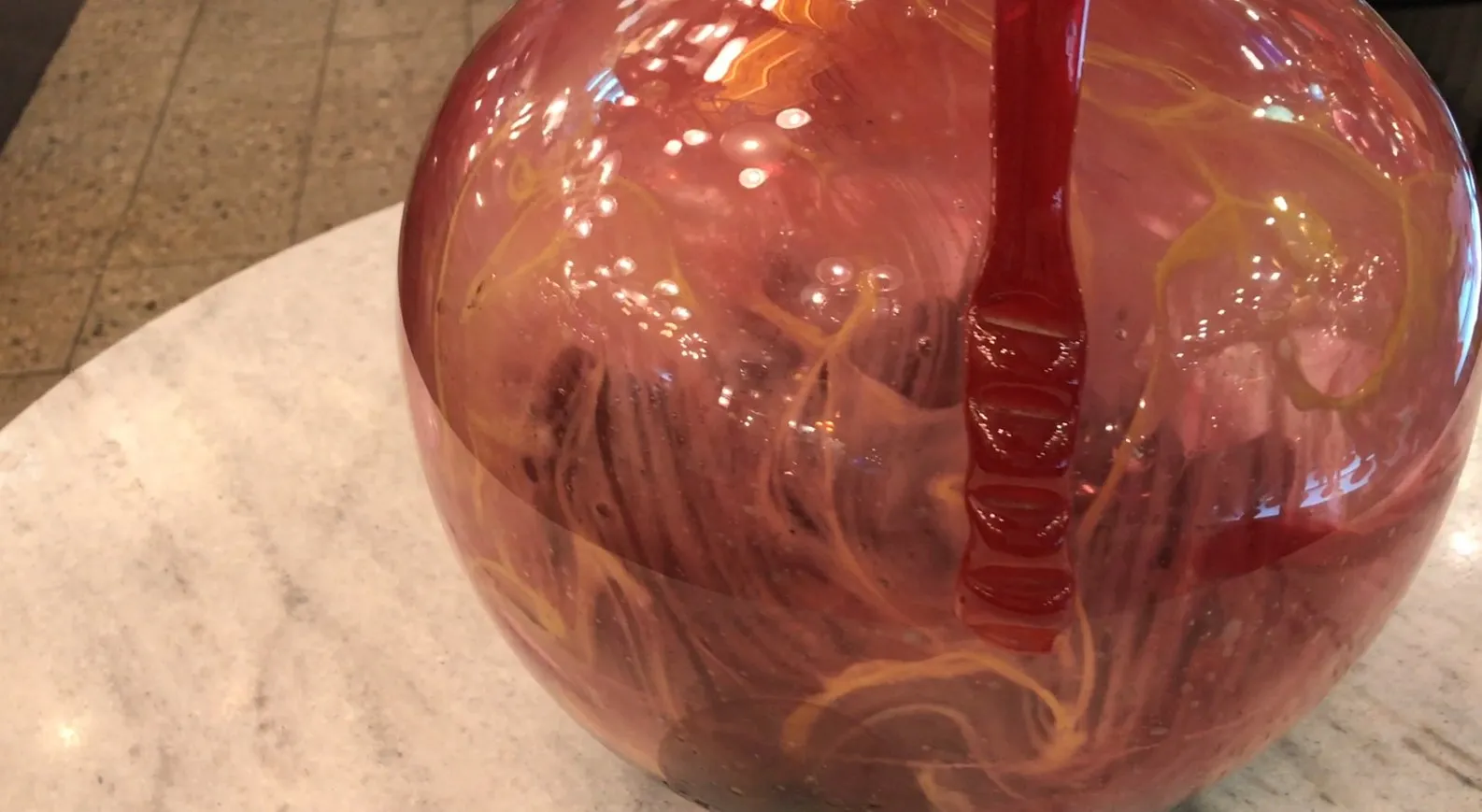 antique glass in warm tones with unique design and signature