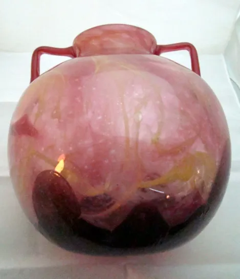glass vase with pink and black tones, antique style.