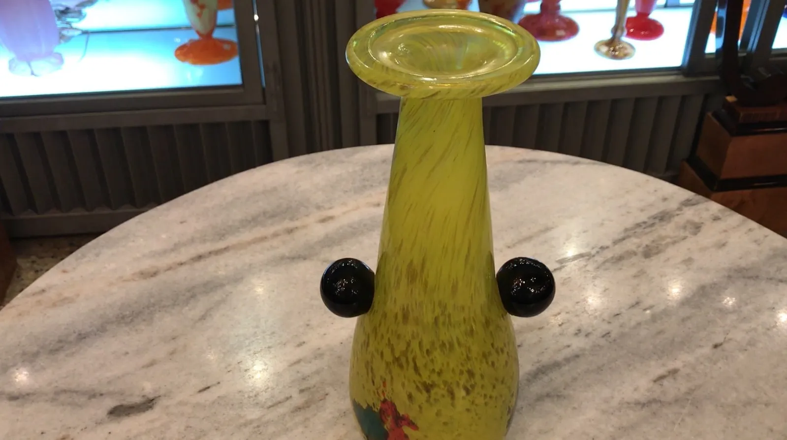 Antique yellow vase with multicolored details