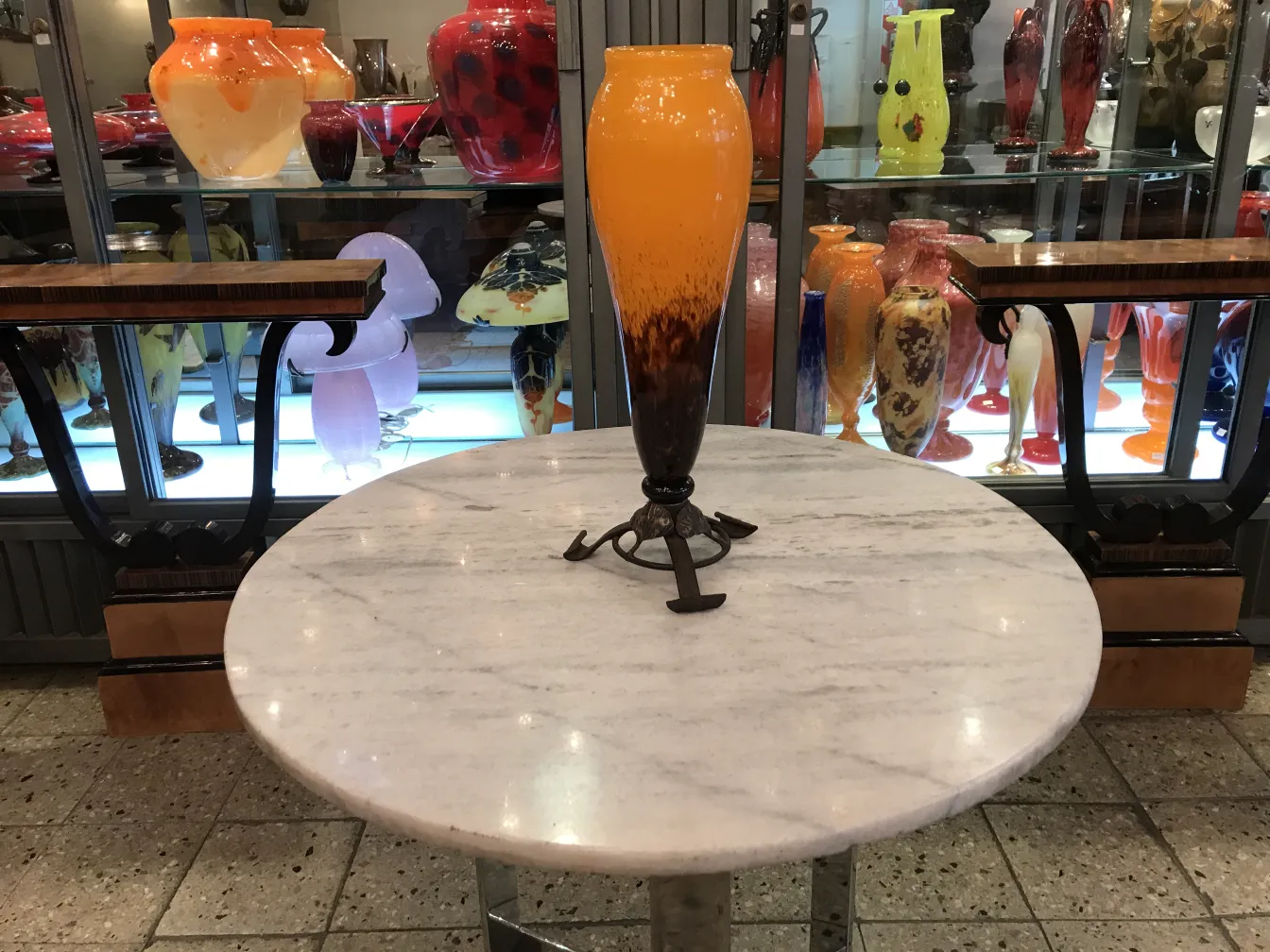 antique signed glass by Schneider with orange tones, decorative background