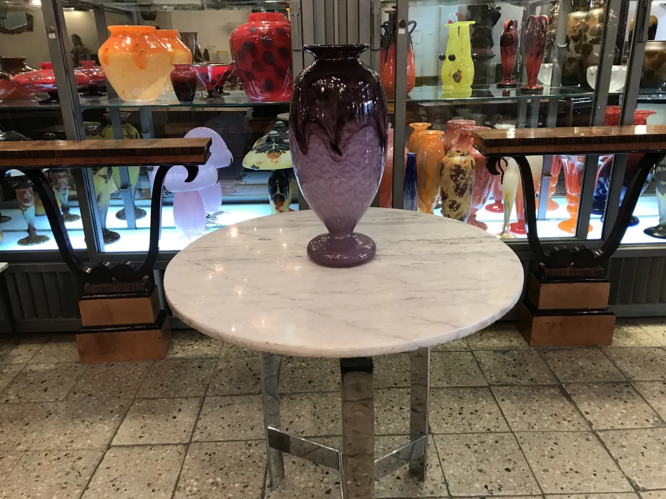 Antique glass with signature in purple color on a table
