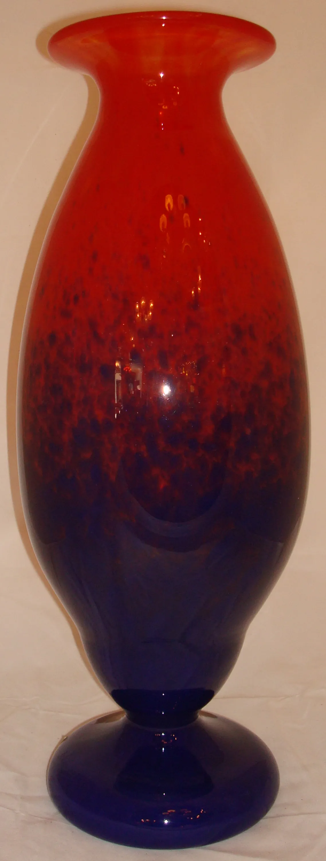 Antique piece featuring an attractive red and blue design.