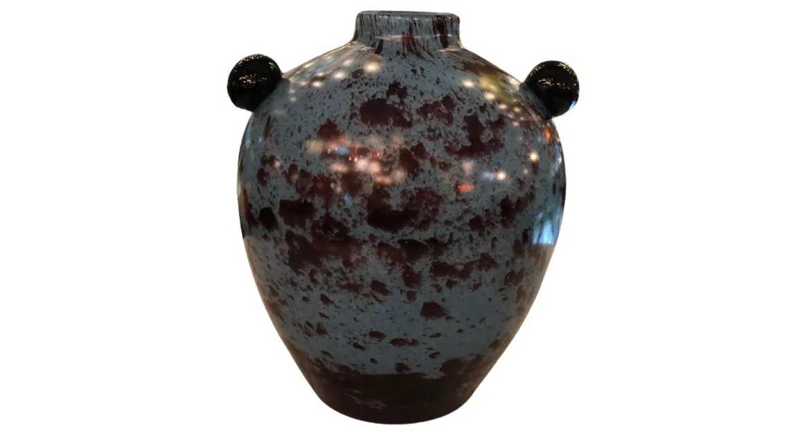 Front view of an antique piece of signed glass with distinctive signs