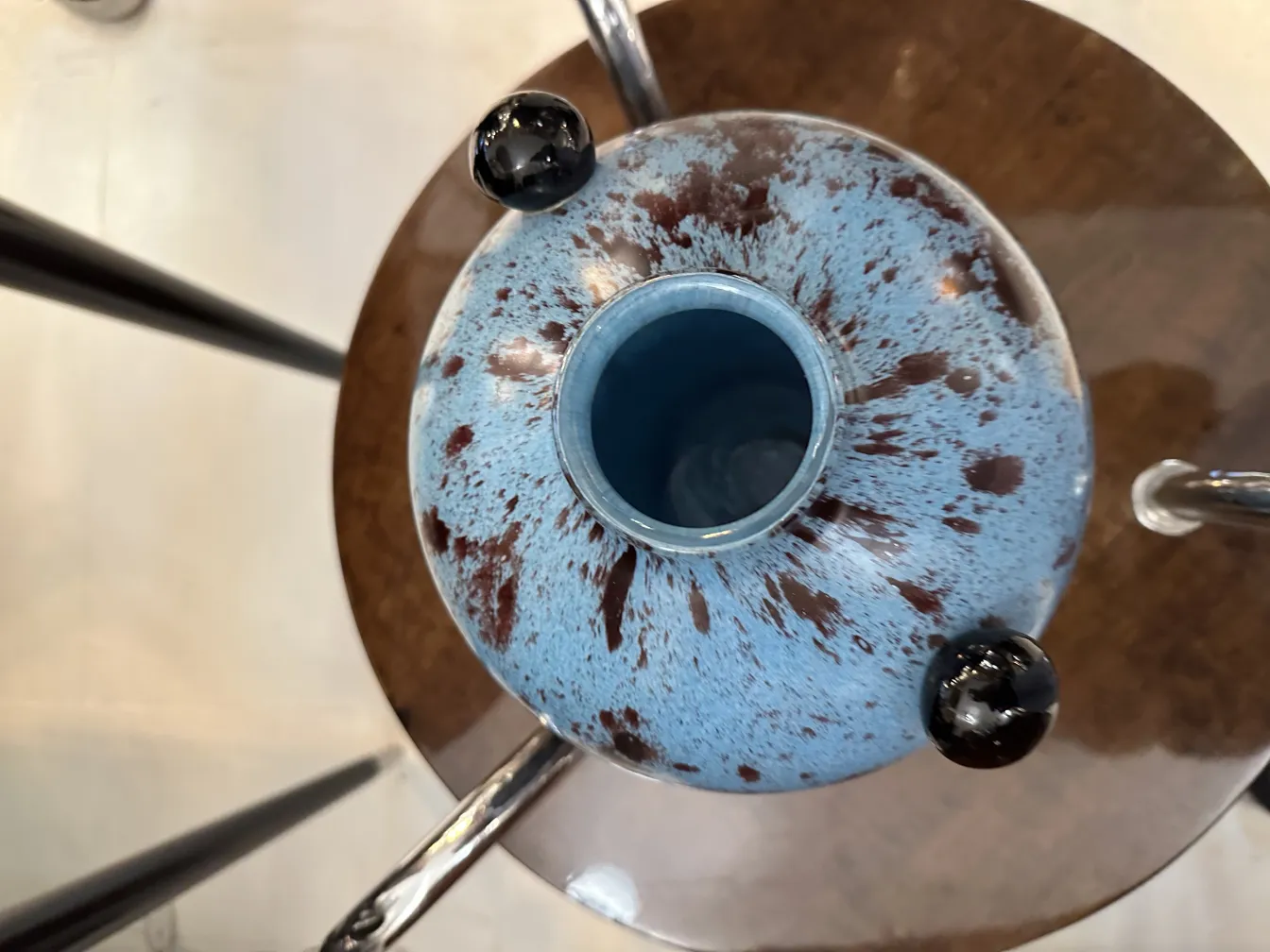 Top view of an antique with blue and black details