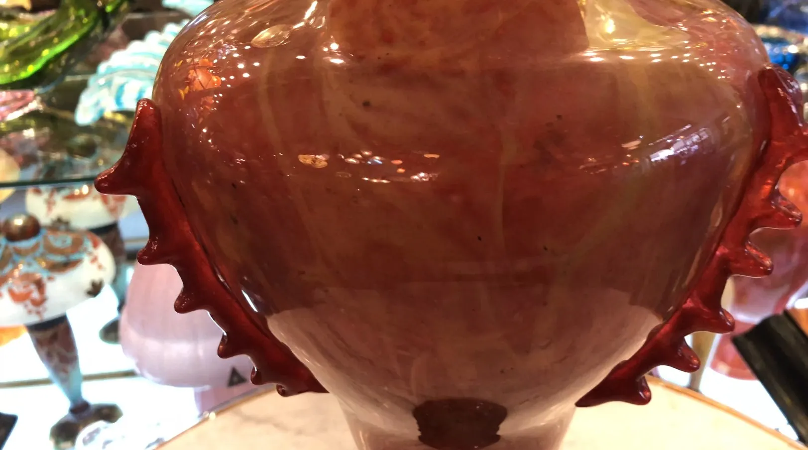 detail of signed glass in antique style with intricate design