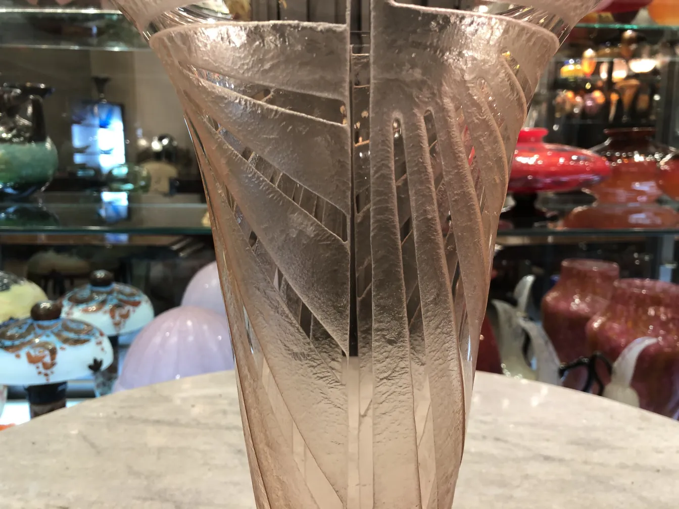 antique glass vase with signature, carved design, assorted background