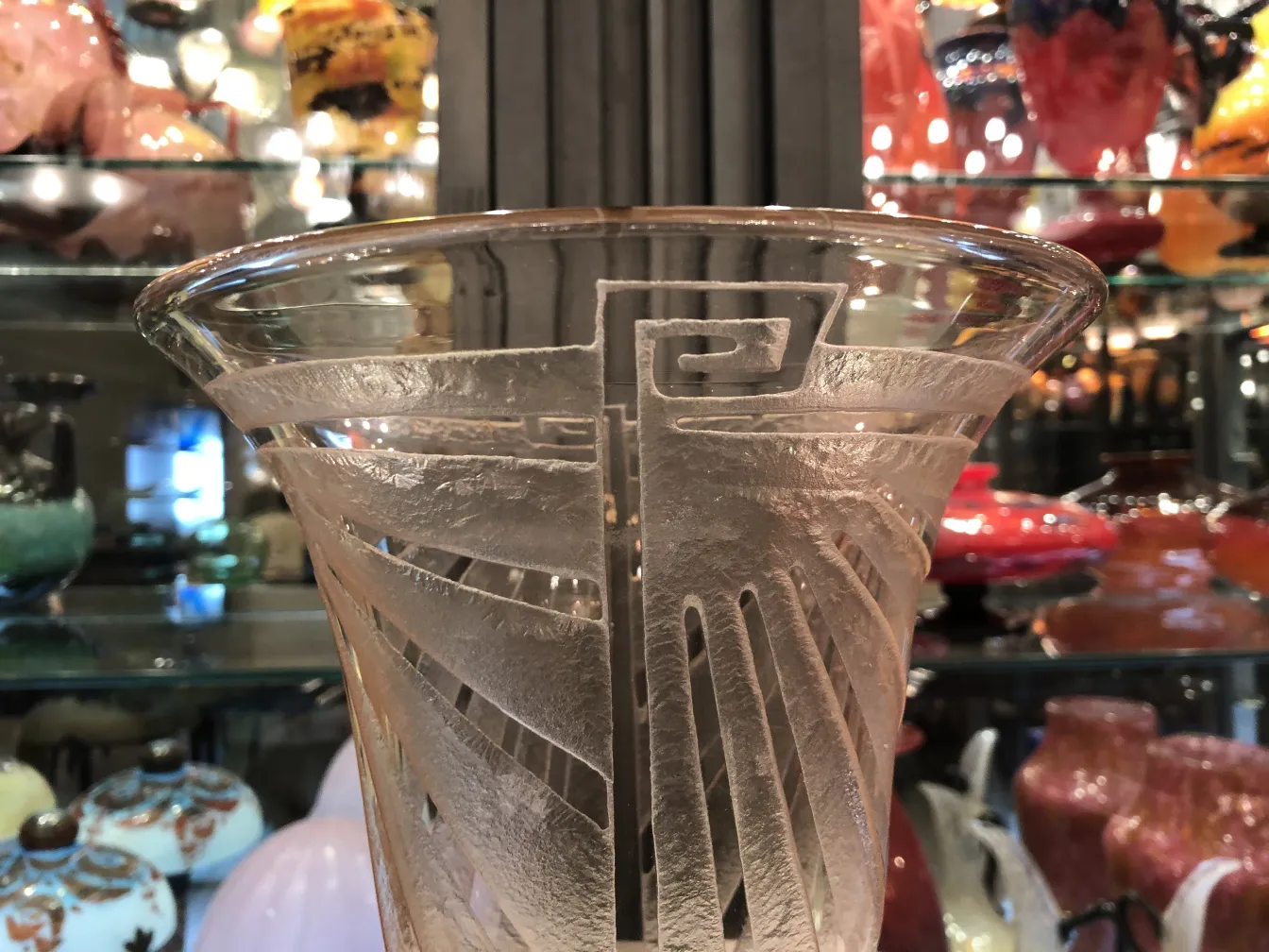 Antique signed glass with graphic details on the surface
