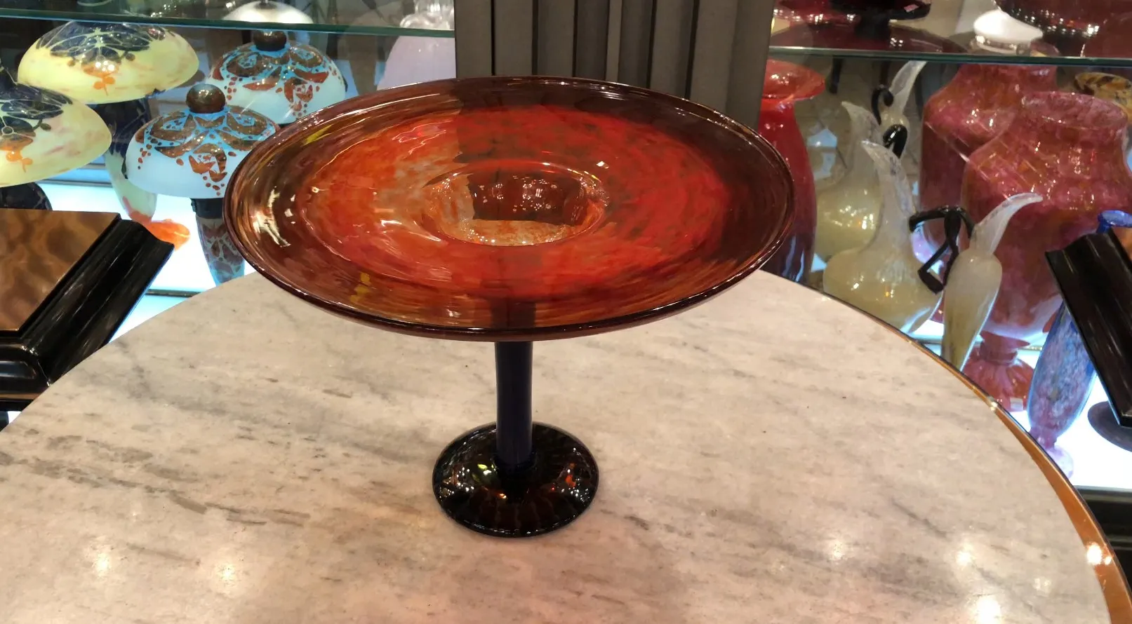 signed Schneider glass on a pedestal, red color
