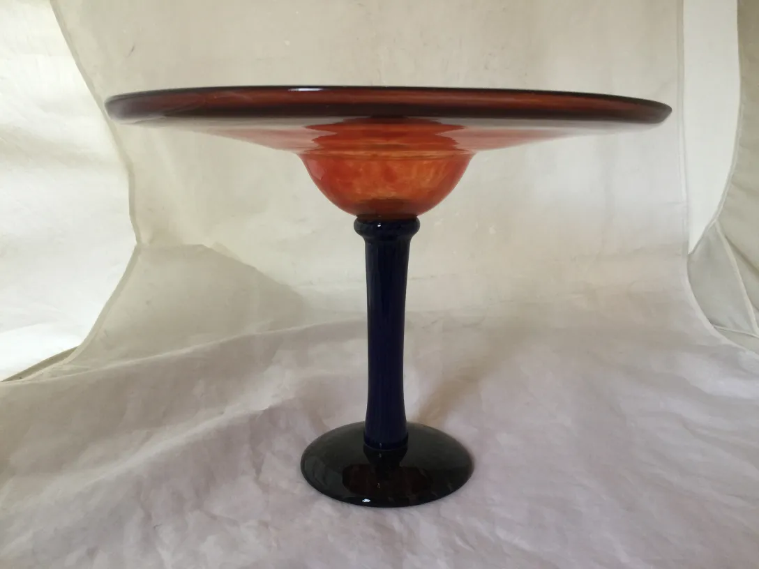Signed glass with dark blue base and wide shape