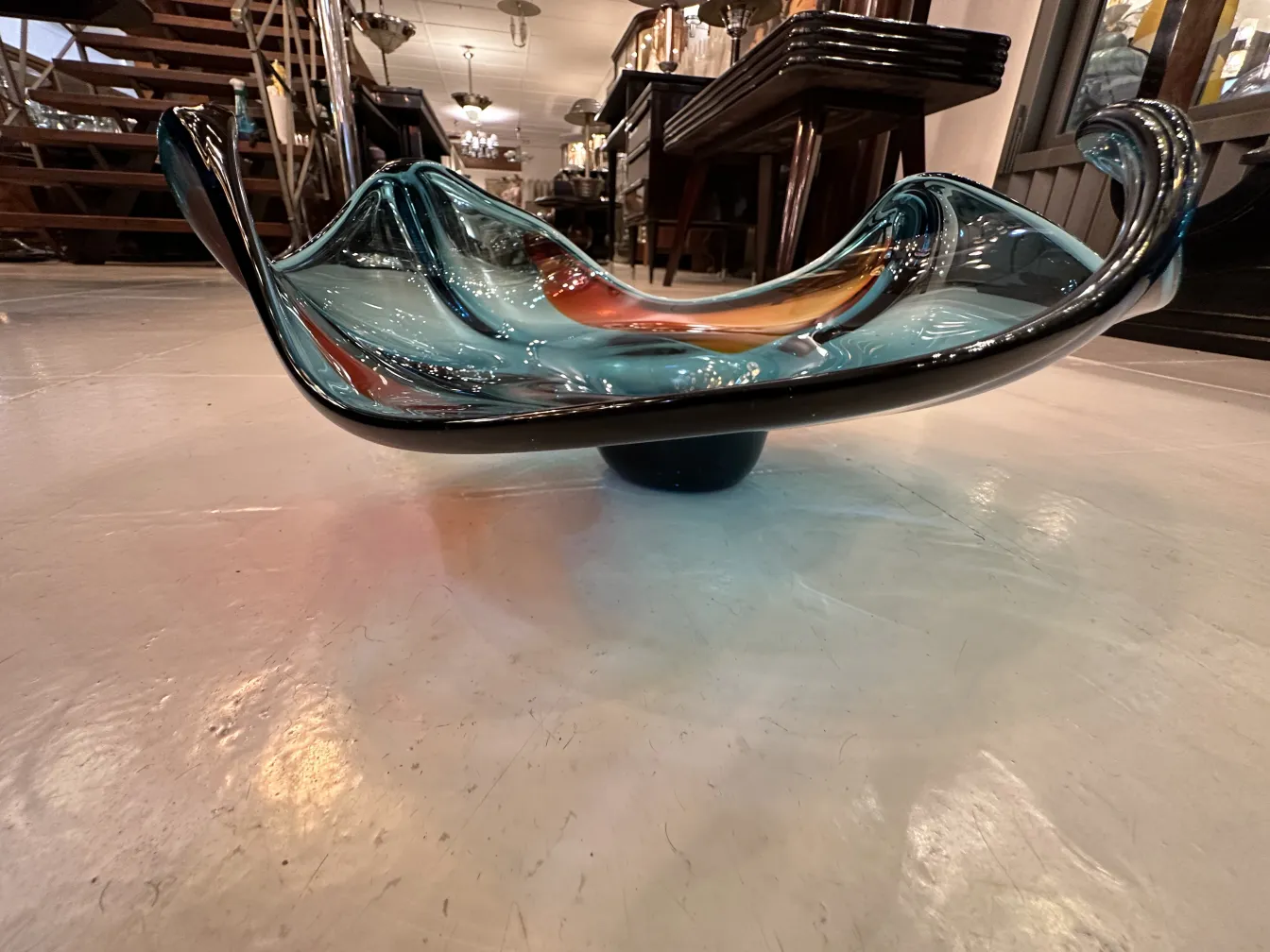 murano glass plate in blue and orange tones with wavy shape