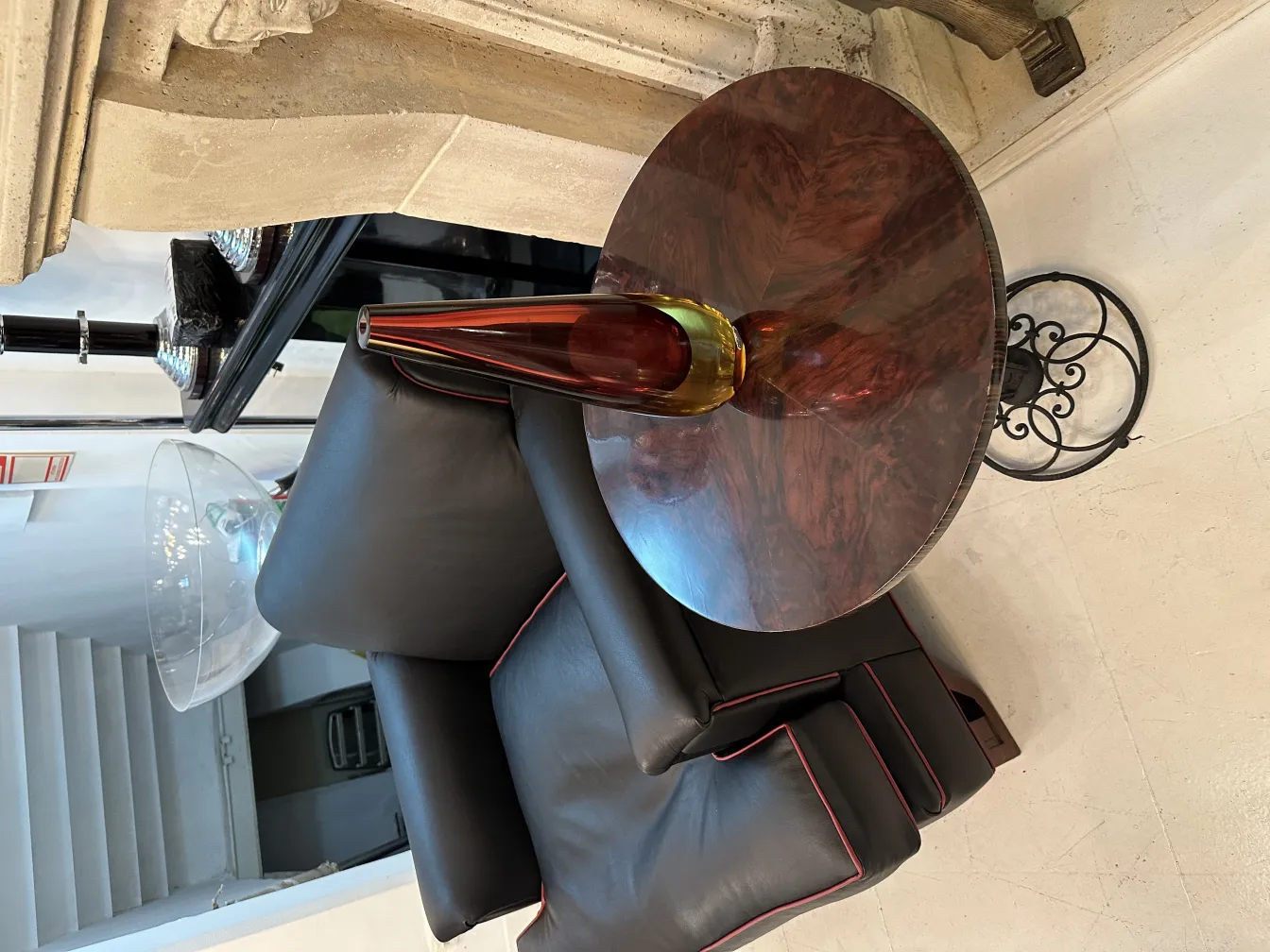 Antique Murano glass vase with brown and yellow tones, decorating a modern table.