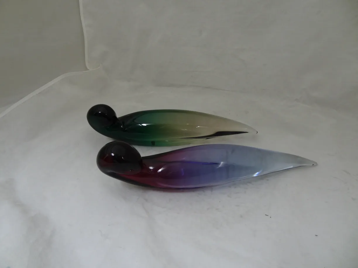 murano glass figures in various colors on a light background