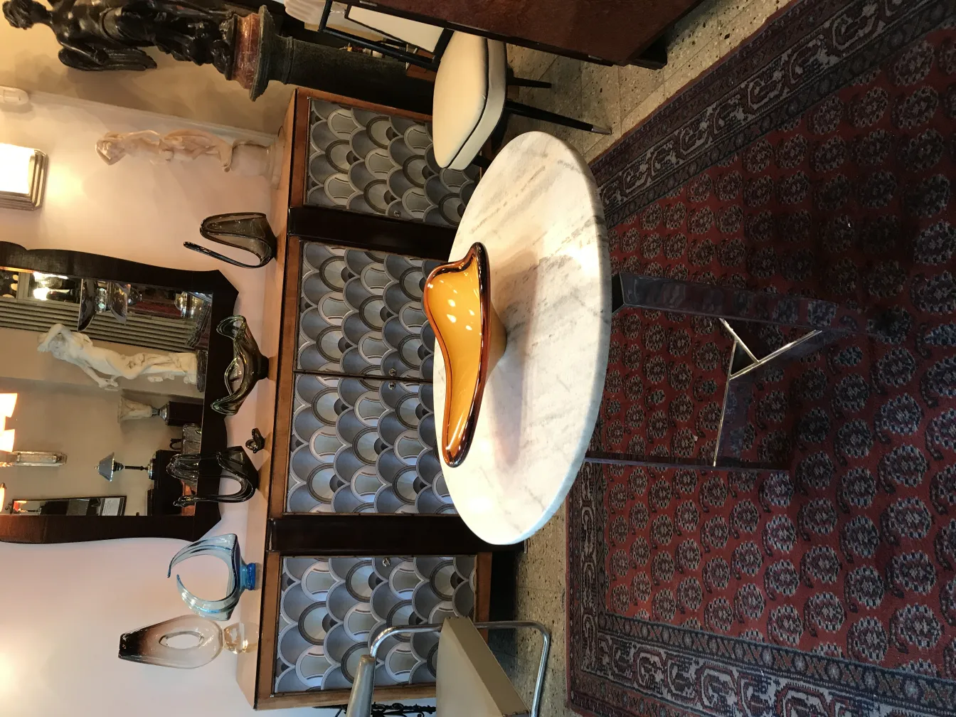 Elegant antique Murano glass in organic shape, warm colors