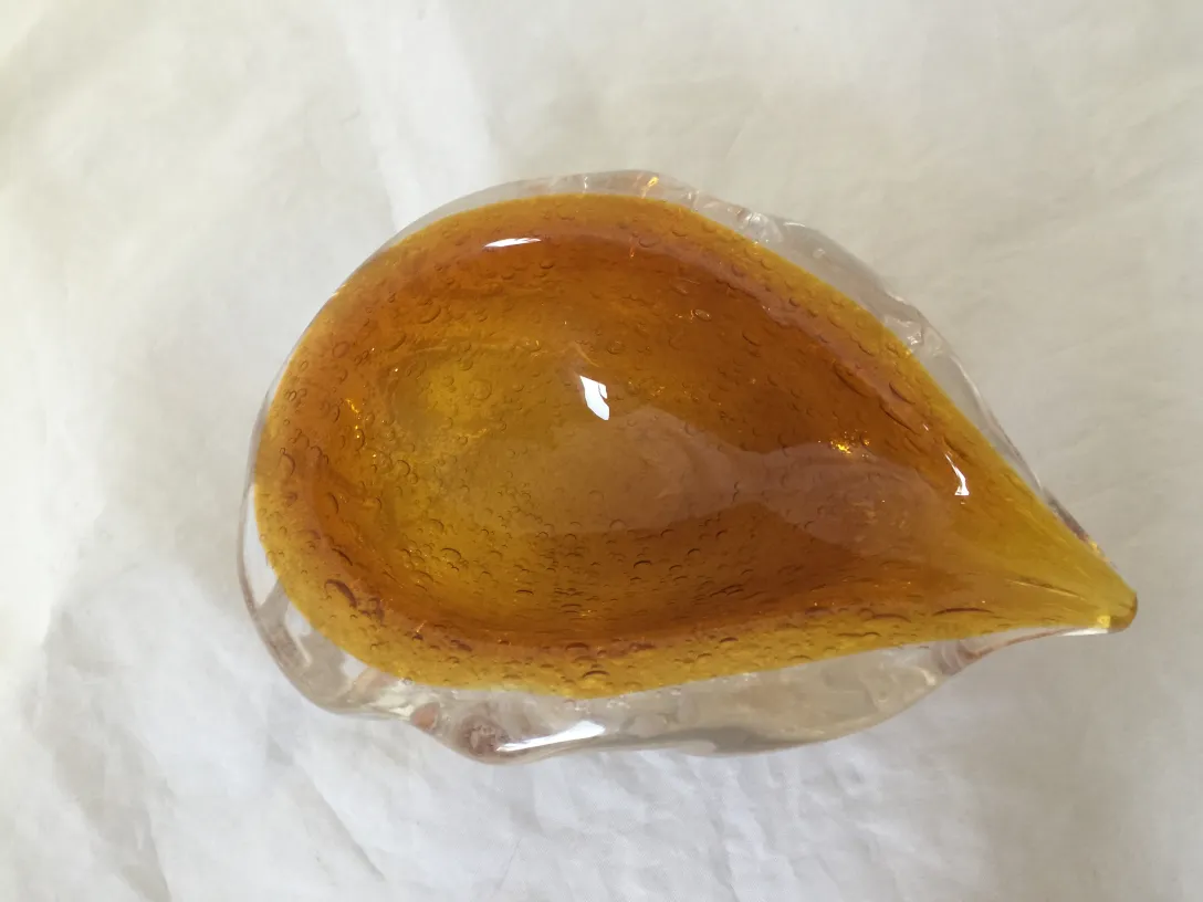 antique murano glass piece with amber tones