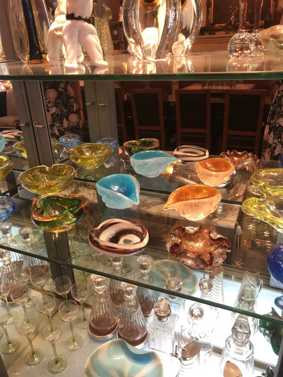 colorful antique Murano glass pieces on shelf