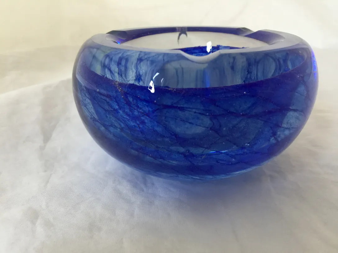 murano glass piece in blue with sparkles