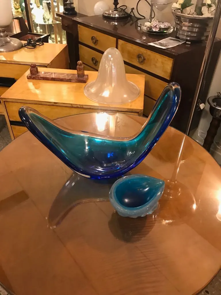 murano glass bowl in blue and green on a wooden table