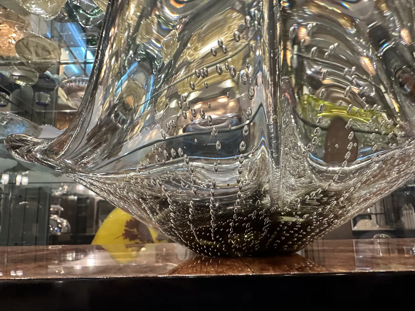 decorative murano glass piece with bright bubbles in a clear background