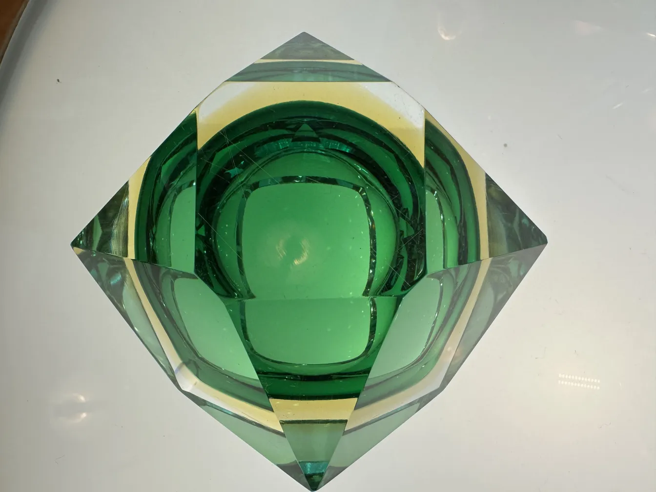 Antique green Murano glass with geometric shapes in a clear setting