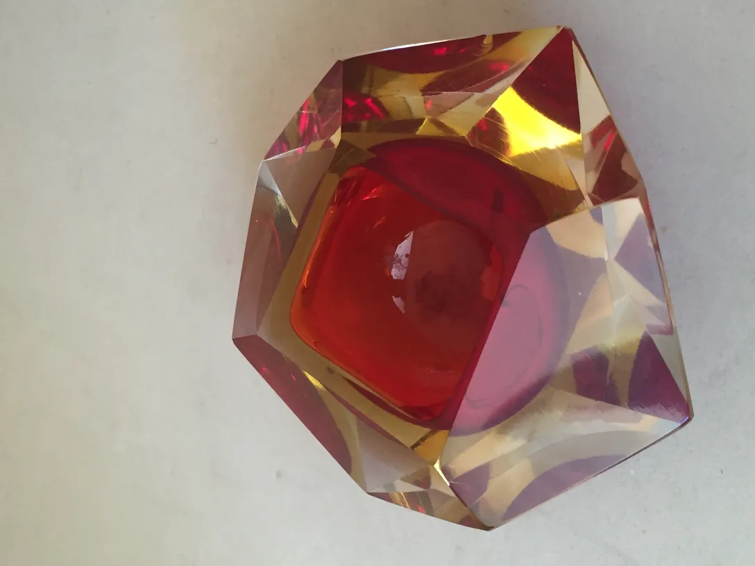 Antique Murano glass in red and amber faceted shape