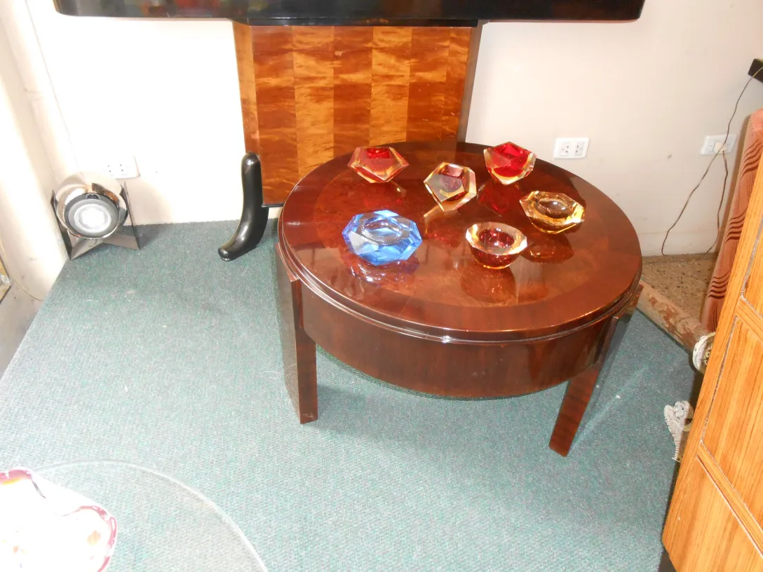 Antique Murano glass pieces in various colors on a table