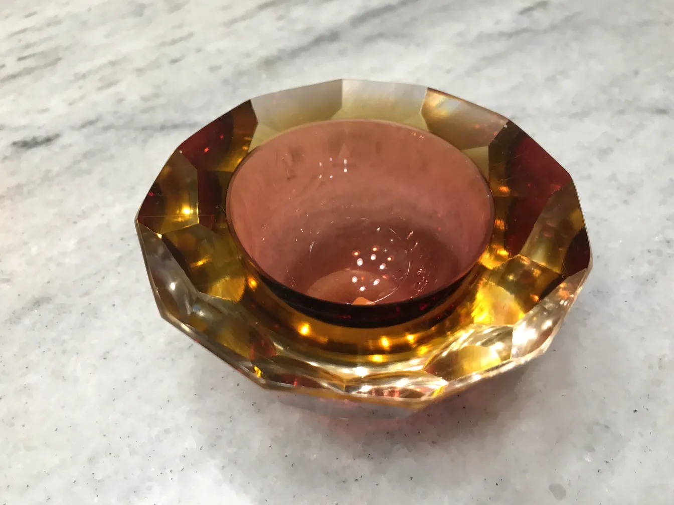 murano glass in amber and pink tones with faceted design