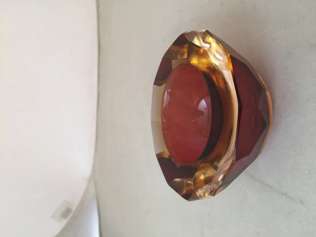 decorative murano glass piece in orange and red hues