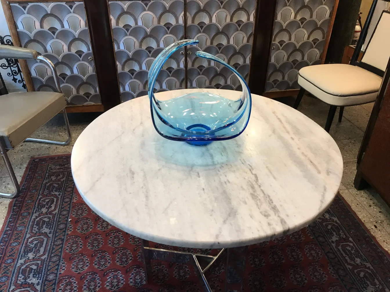 Antique murano glass light blue with elegant shapes on marble table