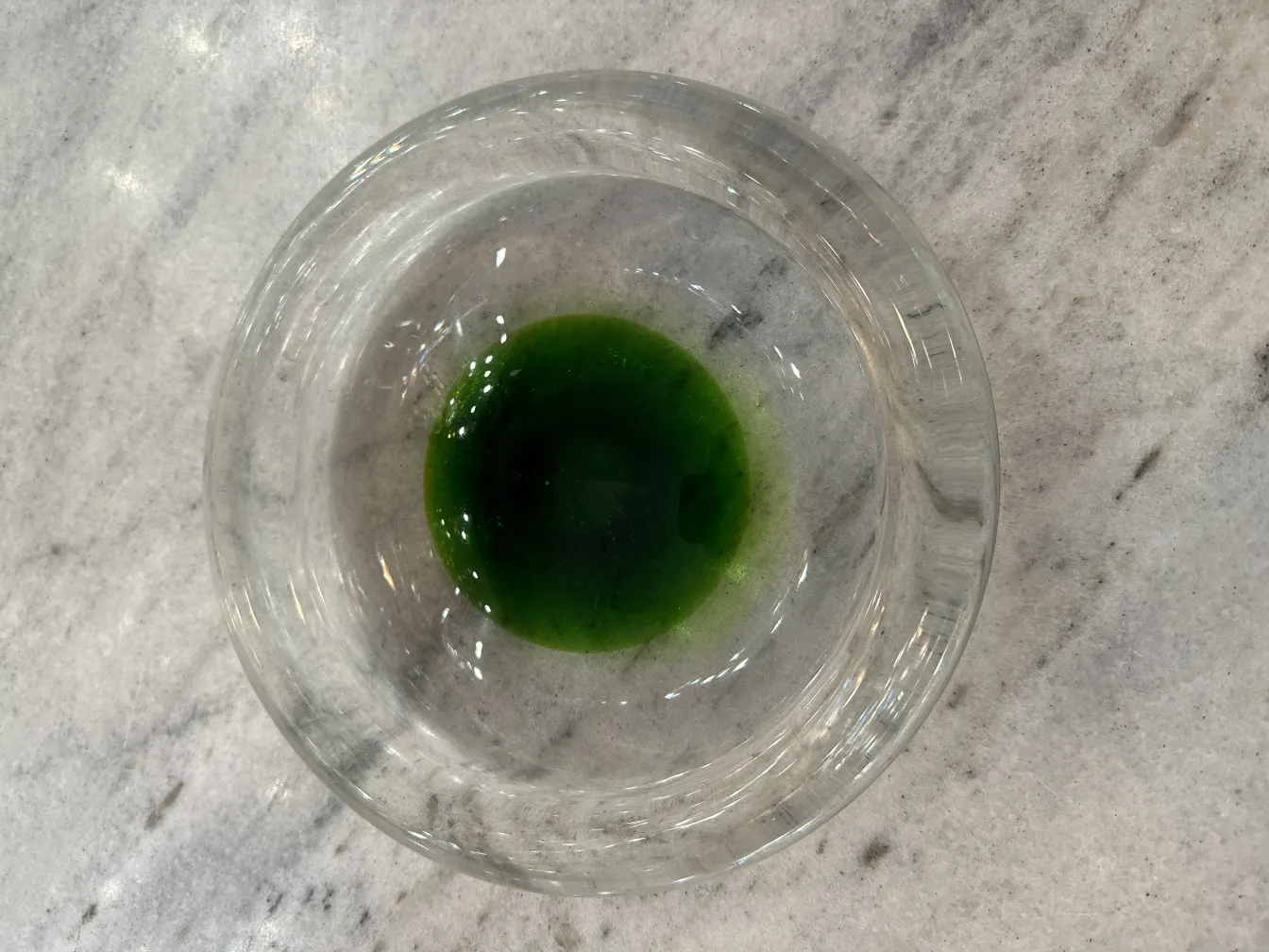 antique murano glass piece with green center at the base