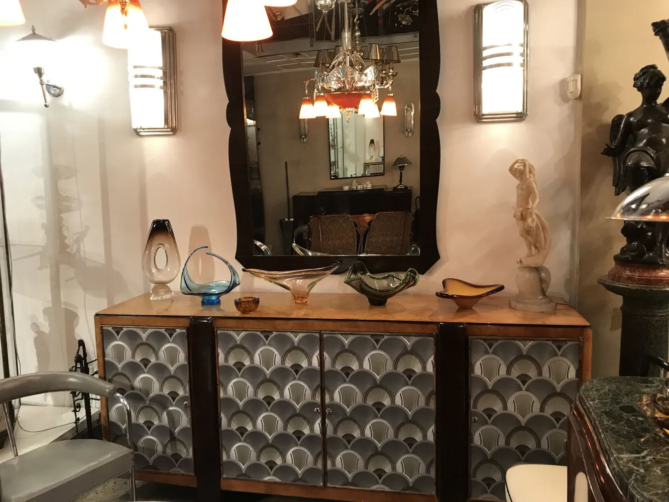 beautiful murano glass on an antique display with lights